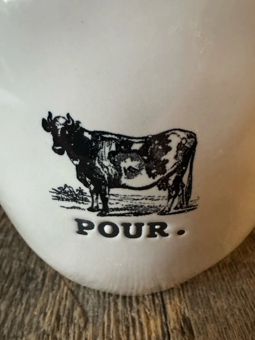 Rae Dunn “Pour.” Ceramic creamer with Cow Graphic